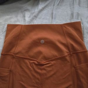Athleta salutation stash pocket ll 7/8 tight women xs orange